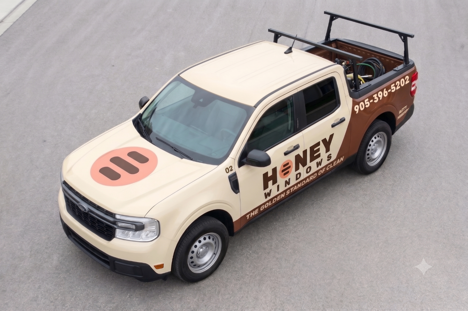 The Honey Windows truck — cream and cocoa Ford Maverick with the Honey Windows logo and 905-396-5202 on the door